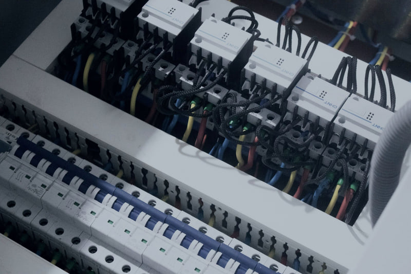 Neatly loomed and labelled wiring inside a switch panel
